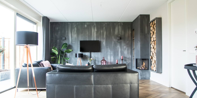 woonkamer modern grijs inbouw verticaal hout hoek industriele look 